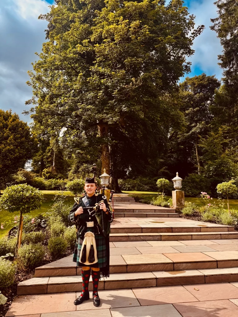 bagpiper at penicuik house for highland games welcome event